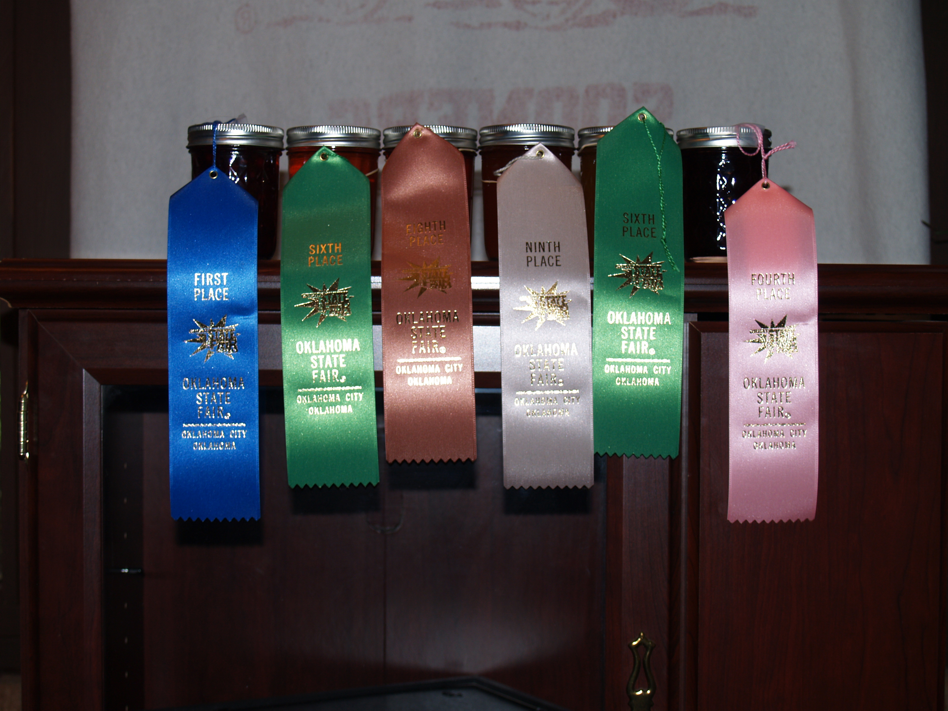 I entered twelve jars of different kinds of jelly/jam and I came home with eleven ribbons, one of them a blue first place ribbon!