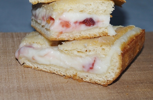 Strawberry Cheese Cake Crescent Bars. A wonderful, quick and easy treat for special occasions or any day. From Kelli's Kitchen 